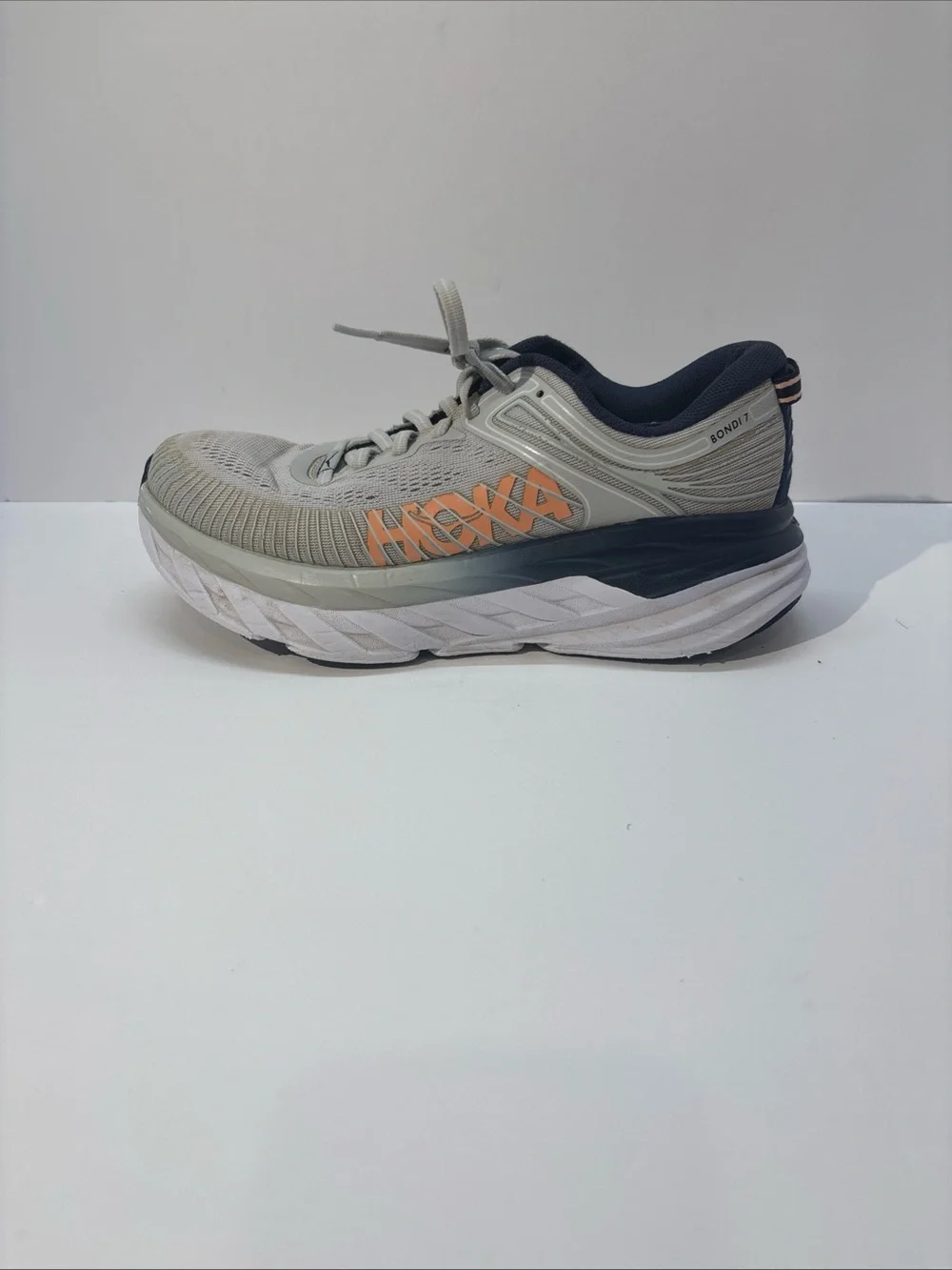 Hoka women’s size 7 gray/peach Bindi 7 style #110531 LRBI in fair condition.